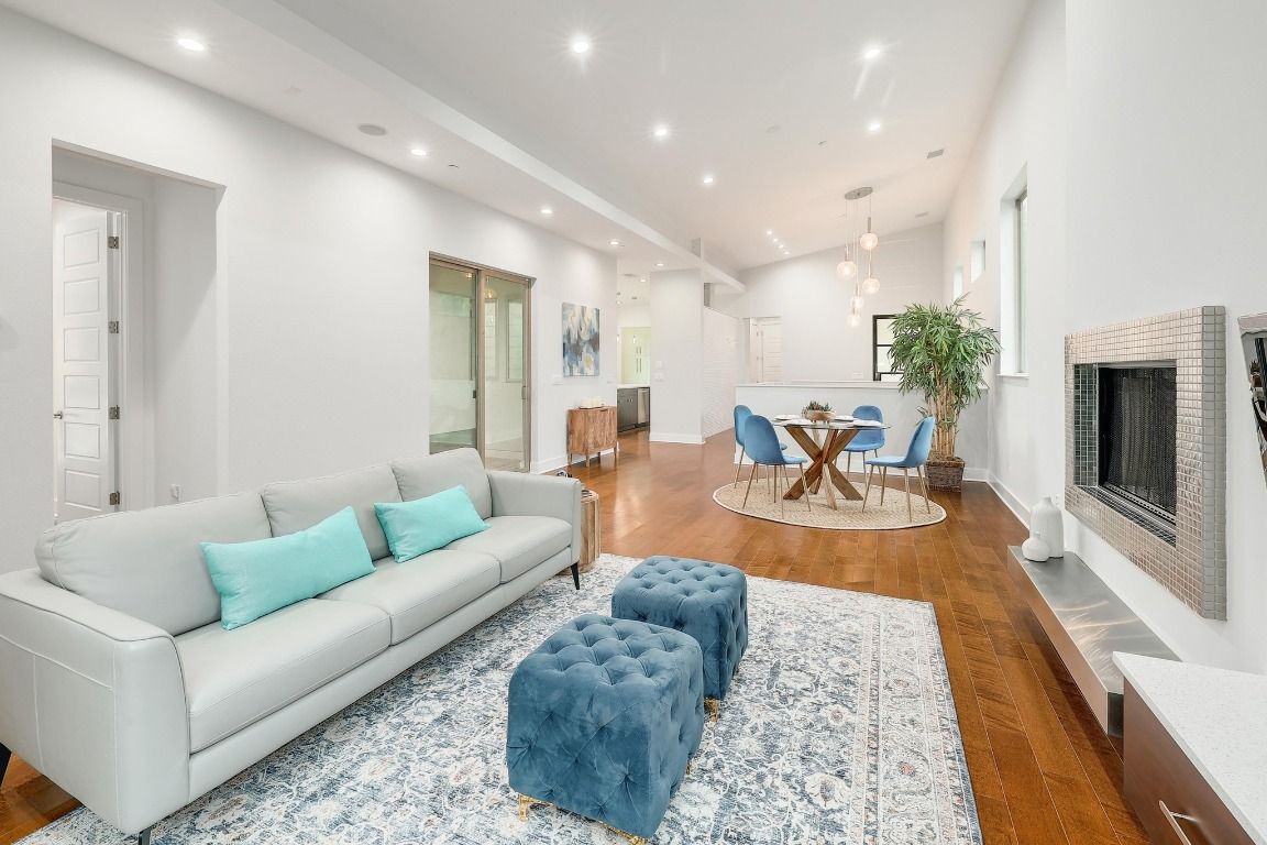 Dining room, Fireplace, Interior, Living room, Pendant Lights, Recessed Lighting, Wood Texture Flooring