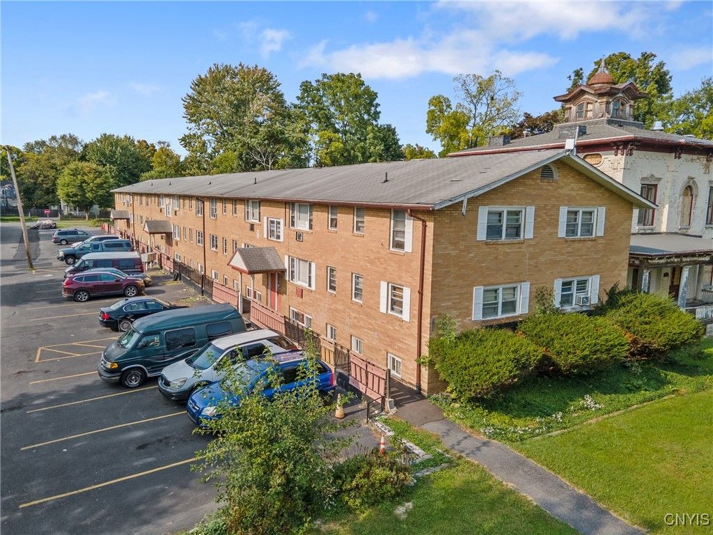 Exterior, Facade, Brick Facade, Condo Building