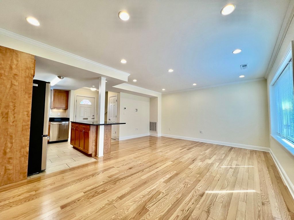 Empty room, Interior, Kitchen, Recessed Lighting, Stainless Steel Appliances, Wood Texture Flooring
