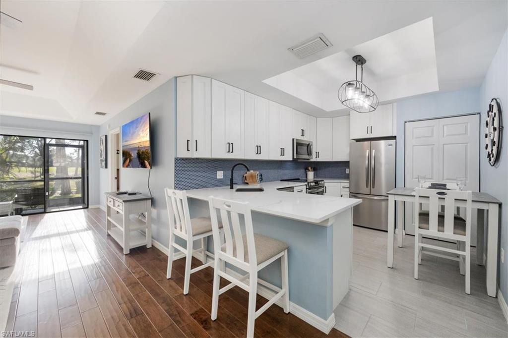 Dining room, Interior, Kitchen, Pendant Lights, Stainless Steel Appliances, Wood Texture Flooring