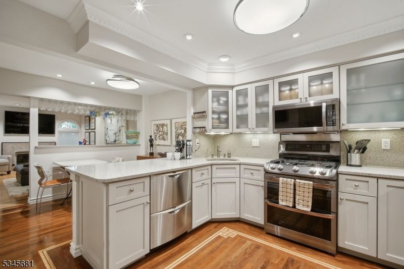 Dining room, Interior, Kitchen, Recessed Lighting, Stainless Steel Appliances, Wood Texture Flooring