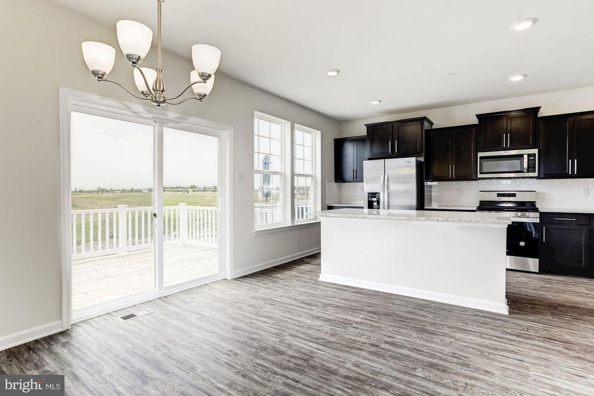 Chandelier, Interior, Kitchen, Pendant Lights, Recessed Lighting, Stainless Steel Appliances, Wood Texture Flooring