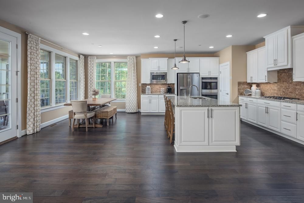 Dining room, Interior, Kitchen, Pendant Lights, Recessed Lighting, Stainless Steel Appliances, Wood Texture Flooring
