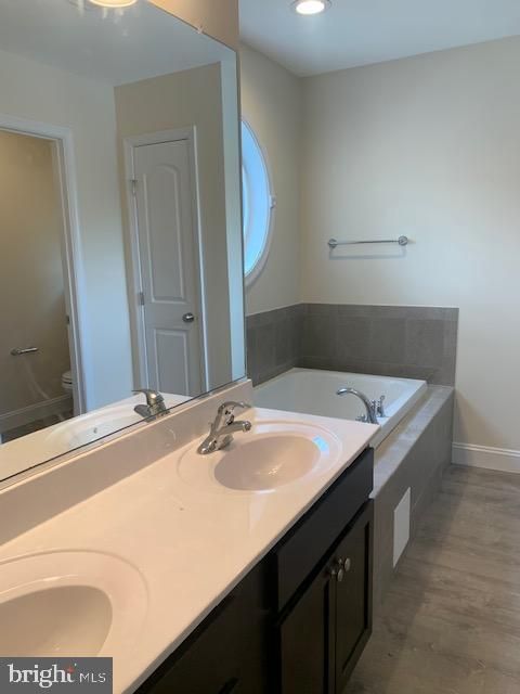 Bathroom, Dual Sink Vanities, Interior, Recessed Lighting, Wood Texture Flooring