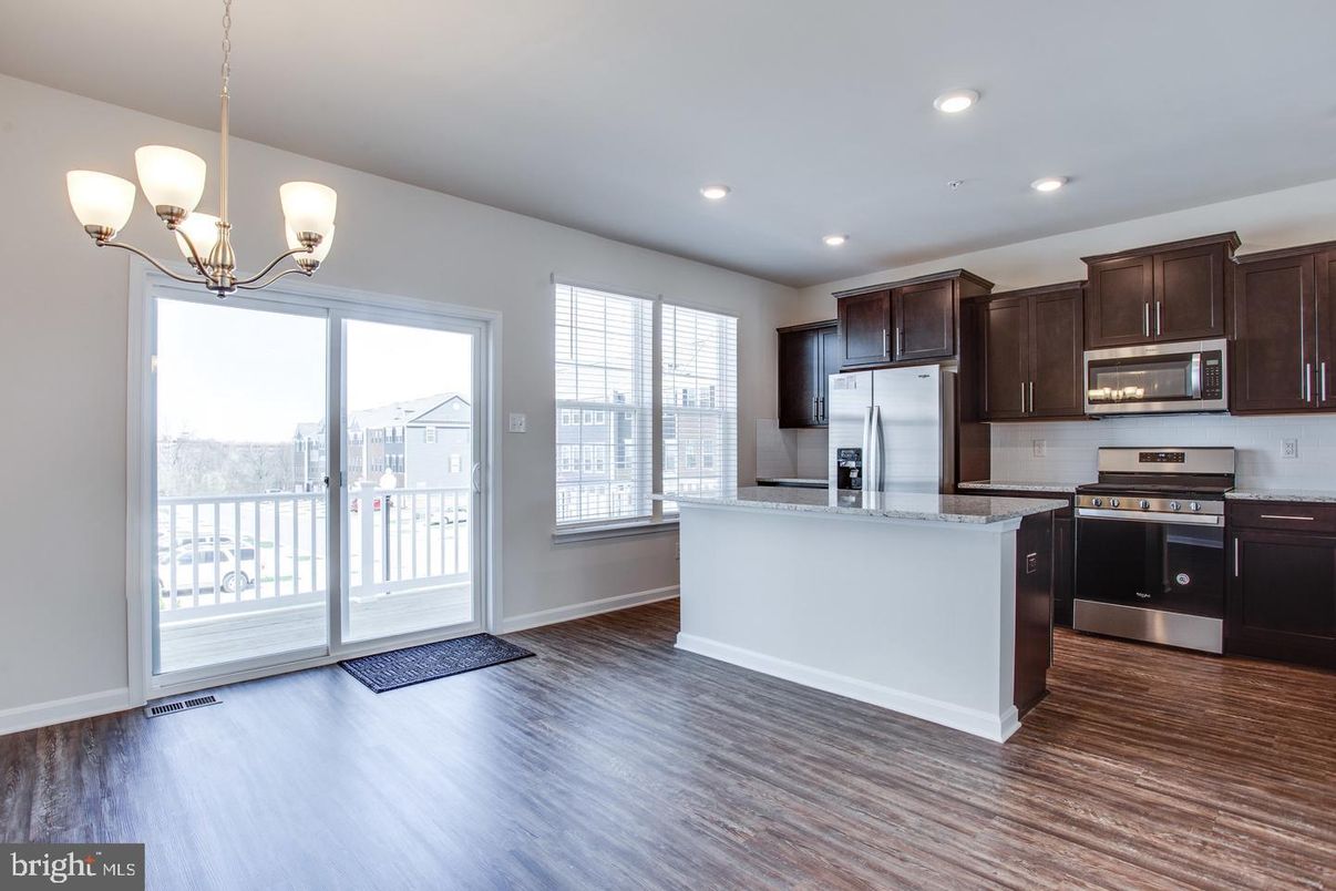 Chandelier, Interior, Kitchen, Pendant Lights, Recessed Lighting, Stainless Steel Appliances, Wood Texture Flooring