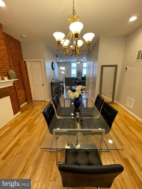 Chandelier, Dining room, Interior, Recessed Lighting, Stone Walls, Wood Texture Flooring