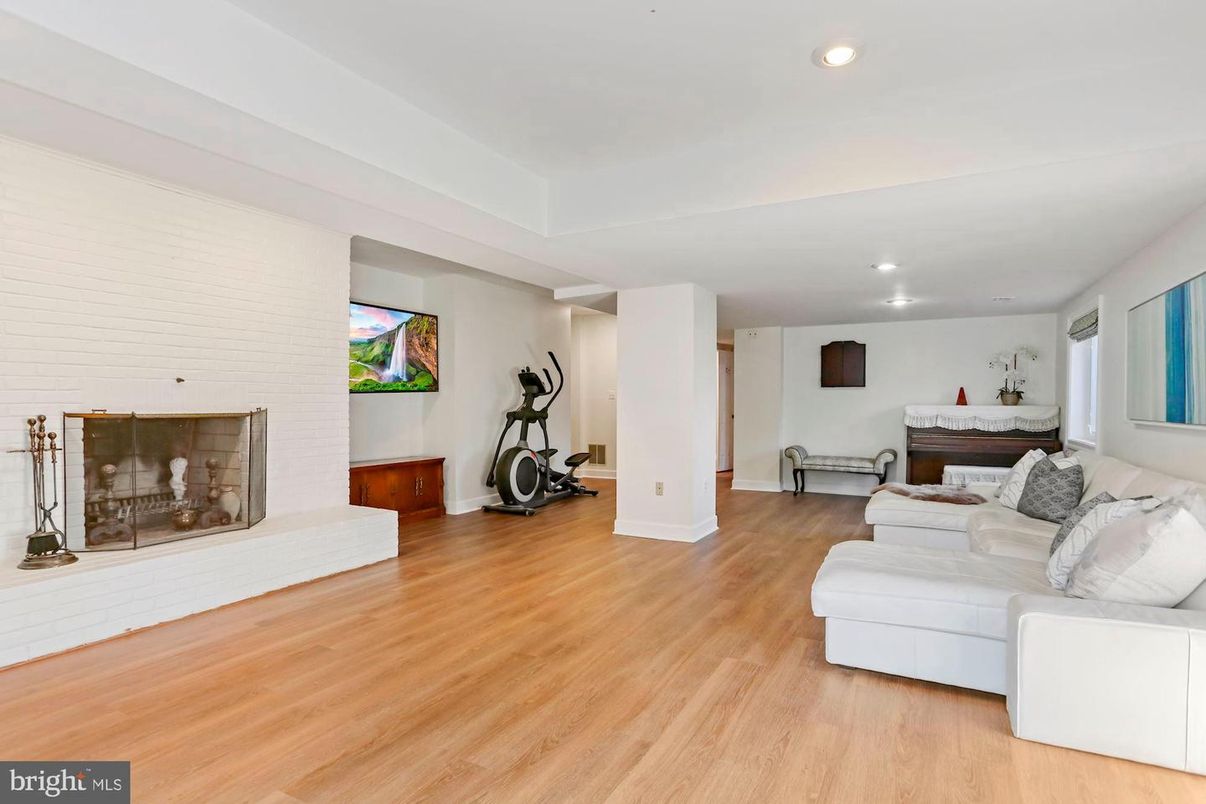 Fireplace, Fitness Equipment, Interior, Living room, Recessed Lighting, Wood Texture Flooring