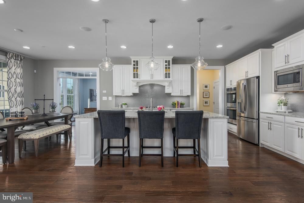 Dining room, Interior, Kitchen, Pendant Lights, Recessed Lighting, Stainless Steel Appliances, Wood Texture Flooring