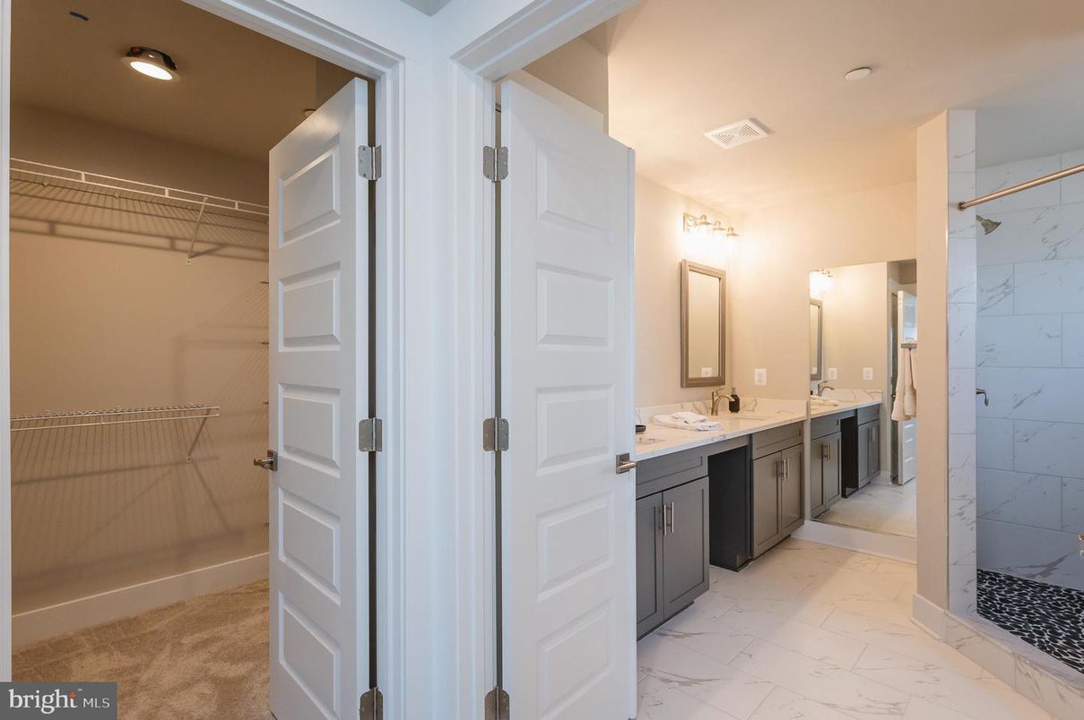 Bathroom, Dual Sink Vanities, Interior, Marble, Marble Walls, Walk-in Closets