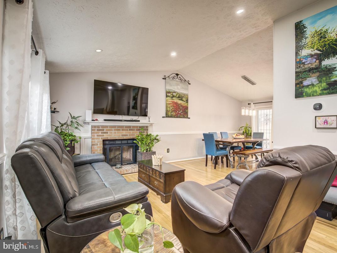 Dining room, Fireplace, Interior, Living room, Pendant Lights, Recessed Lighting, Wood Texture Flooring