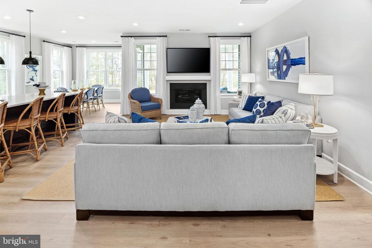 Dining room, Fireplace, Interior, Living room, Pendant Lights, Recessed Lighting, Wood Texture Flooring