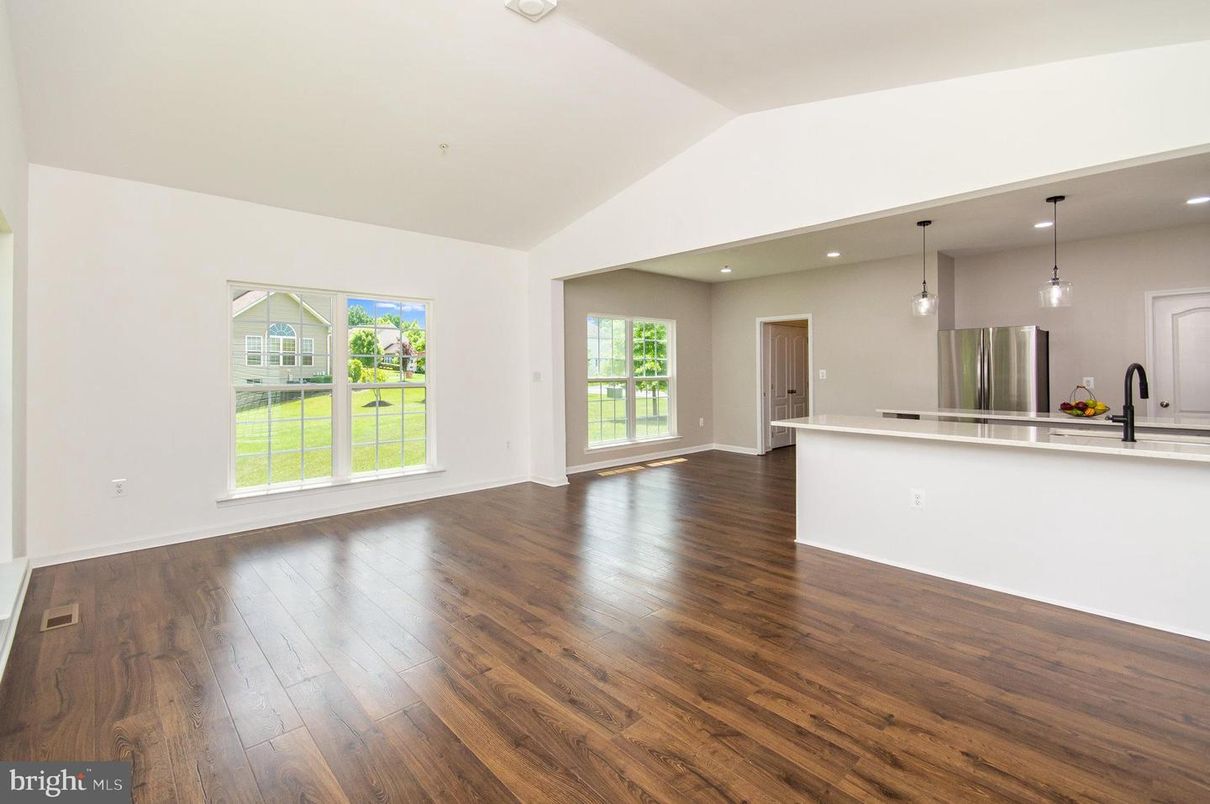 Empty room, Interior, Kitchen, Pendant Lights, Recessed Lighting, Stainless Steel Appliances, Wood Texture Flooring