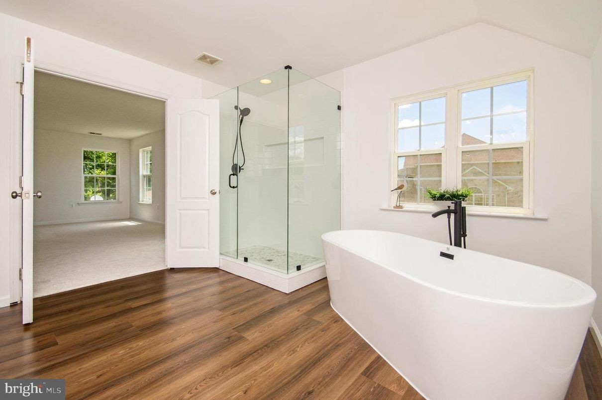 Bathroom, Free Standing Baths, Glass Shower, Interior, Recessed Lighting, Wood Texture Flooring