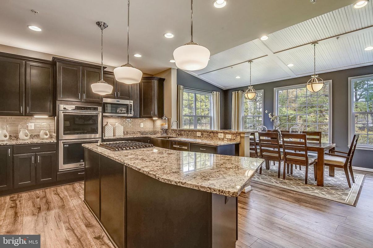 Dining room, Interior, Kitchen, Pendant Lights, Recessed Lighting, Stainless Steel Appliances, Wood Texture Flooring