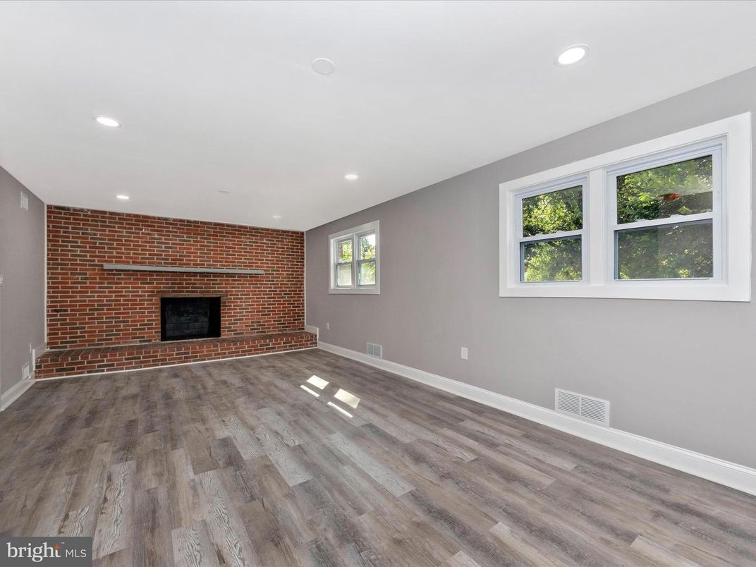 Empty room, Fireplace, Interior, Recessed Lighting, Stone Walls, Wood Texture Flooring