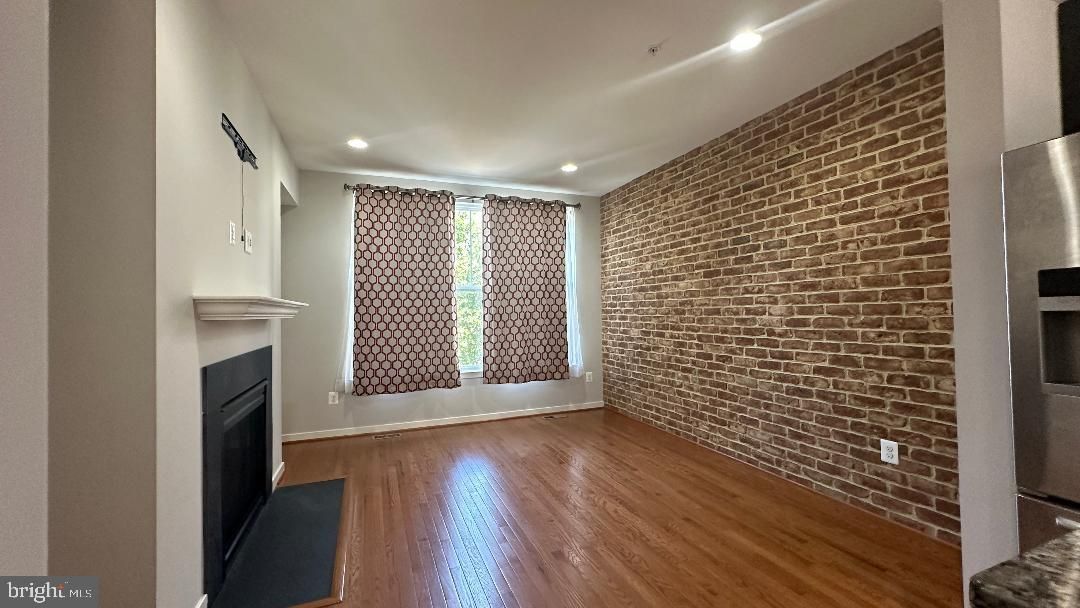 Fireplace, Interior, Recessed Lighting, Stone Walls, Wood Texture Flooring