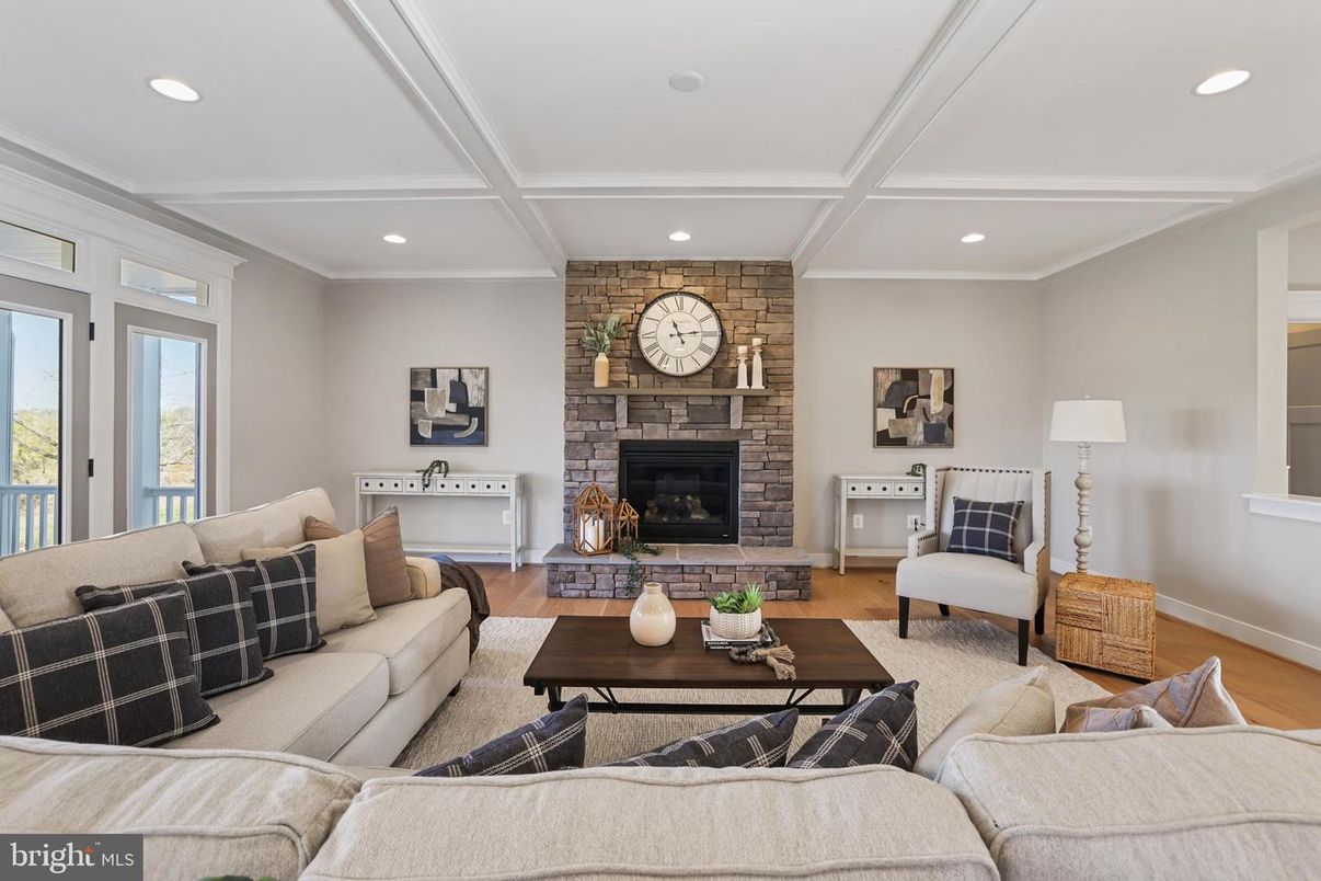 Fireplace, Interior, Living room, Recessed Lighting, Stone Walls, Wood Texture Flooring