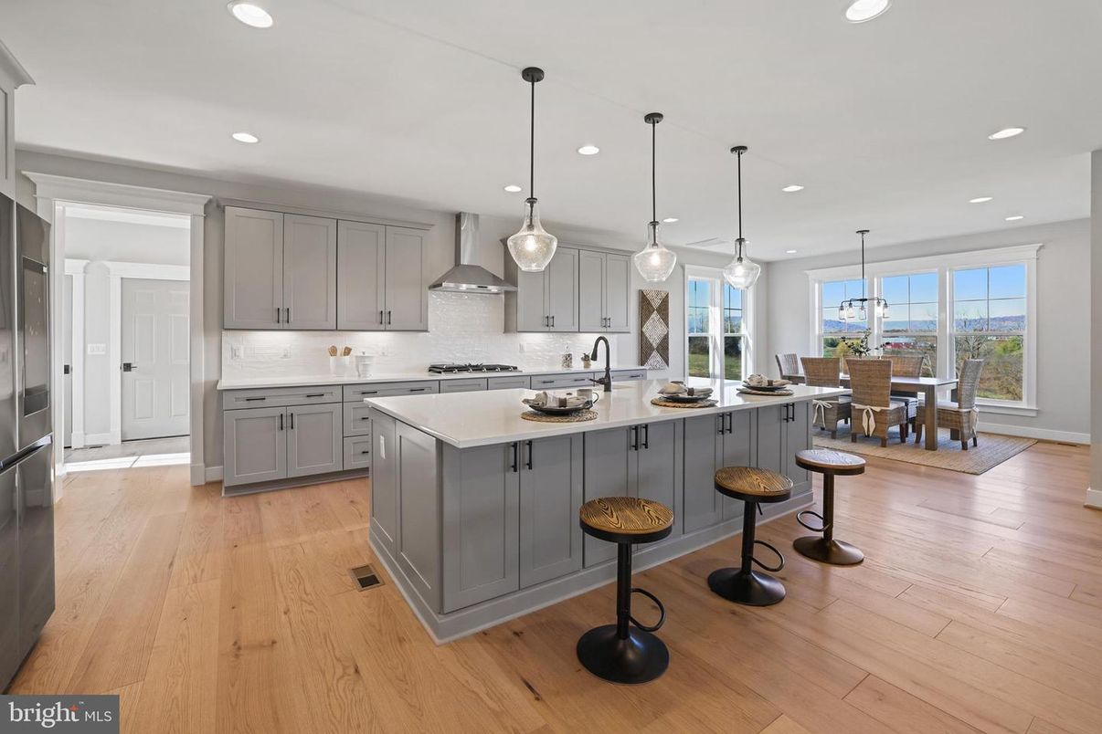 Dining room, Interior, Kitchen, Pendant Lights, Recessed Lighting, Stainless Steel Appliances, Wood Texture Flooring