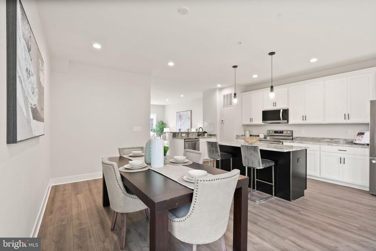 Dining room, Interior, Kitchen, Pendant Lights, Recessed Lighting, Stainless Steel Appliances, Wood Texture Flooring
