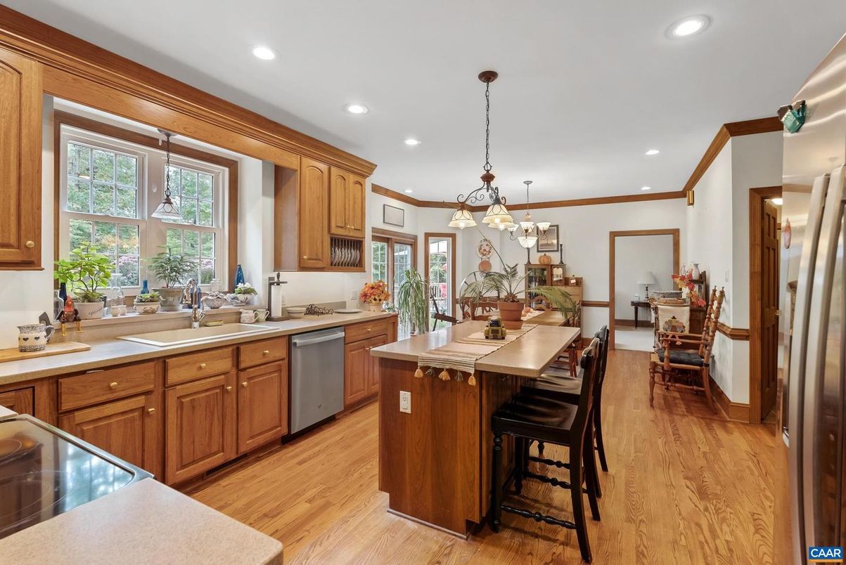 Dining room, Interior, Kitchen, Pendant Lights, Recessed Lighting, Stainless Steel Appliances, Wood Texture Flooring