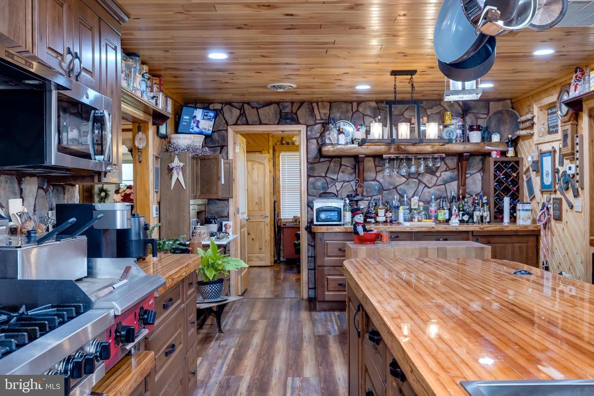 Interior, Kitchen, Pendant Lights, Recessed Lighting, Stainless Steel Appliances, Stone Walls, Wooden Ceilings, Wood Texture Flooring