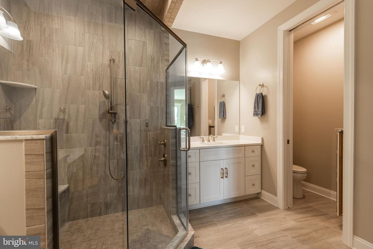 Bathroom, Dual Sink Vanities, Glass Shower, Interior, Wood Texture Flooring