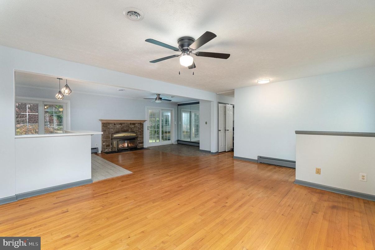 Empty room, Fireplace, Interior, Pendant Lights, Wood Texture Flooring