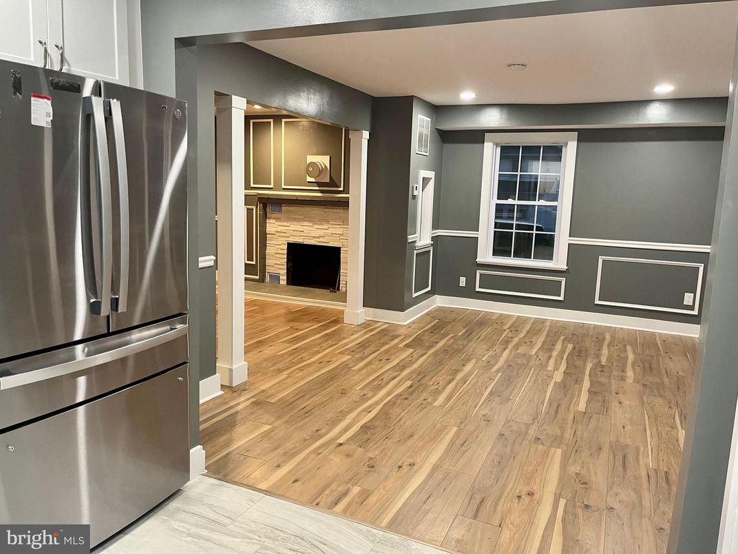 Fireplace, Interior, Kitchen, Recessed Lighting, Stainless Steel Appliances, Wood Texture Flooring