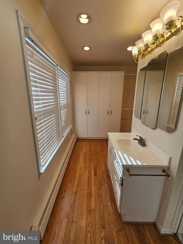 Bathroom, Dual Sink Vanities, Interior, Recessed Lighting, Wood Texture Flooring