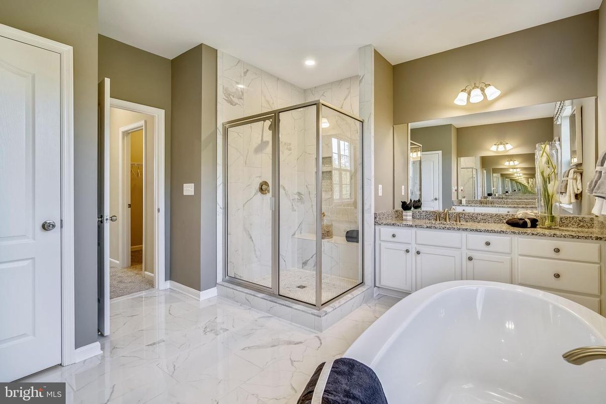 Bathroom, Dual Sink Vanities, Glass Shower, Interior, Marble, Marble Walls, Recessed Lighting