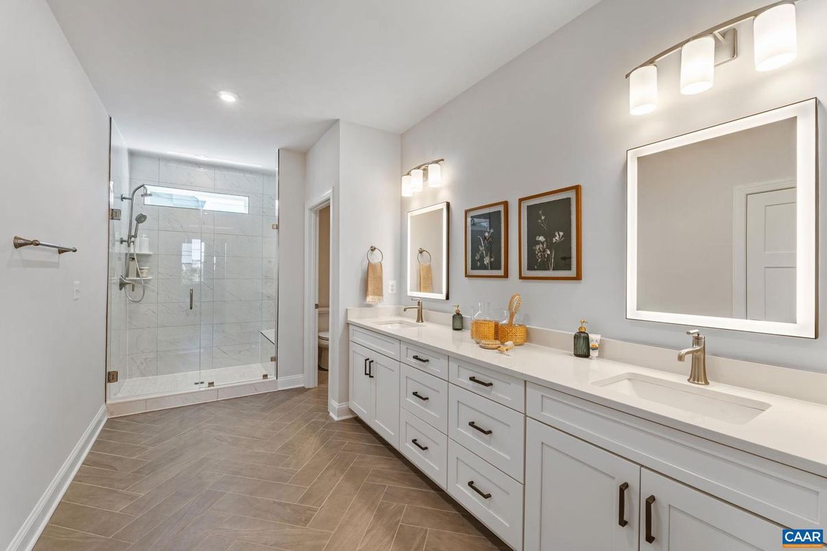Bathroom, Dual Sink Vanities, Glass Shower, Interior, Recessed Lighting, Wood Texture Flooring