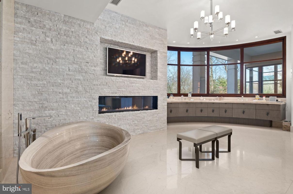 Bathroom, Fireplace, Free Standing Baths, Interior, Marble, Pendant Lights, Recessed Lighting, Stone Walls