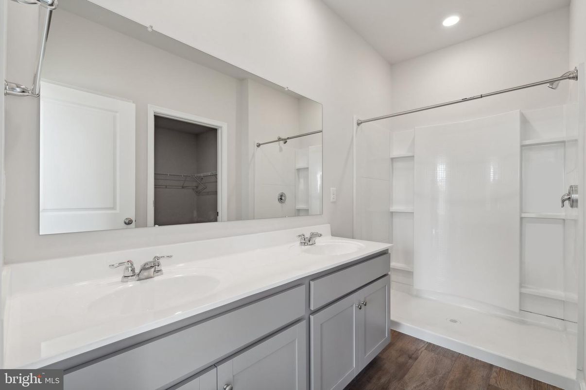 Bathroom, Dual Sink Vanities, Interior, Recessed Lighting, Walk-in Closets, Wood Texture Flooring