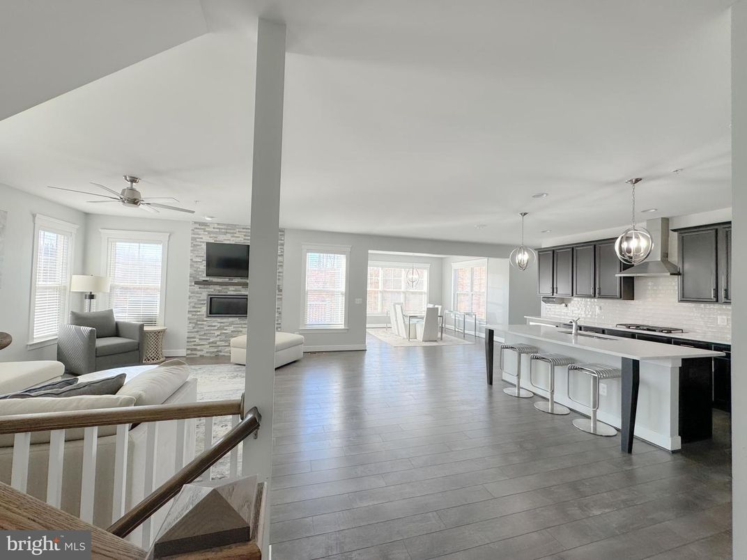 Fireplace, Interior, Kitchen, Living room, Pendant Lights, Stainless Steel Appliances, Wood Texture Flooring