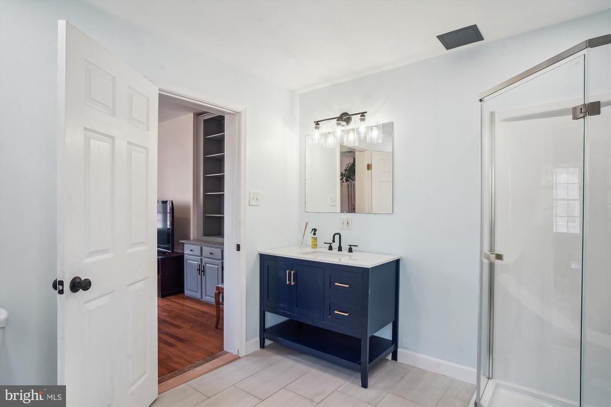 Bathroom, Dual Sink Vanities, Glass Shower, Interior, Wood Texture Flooring