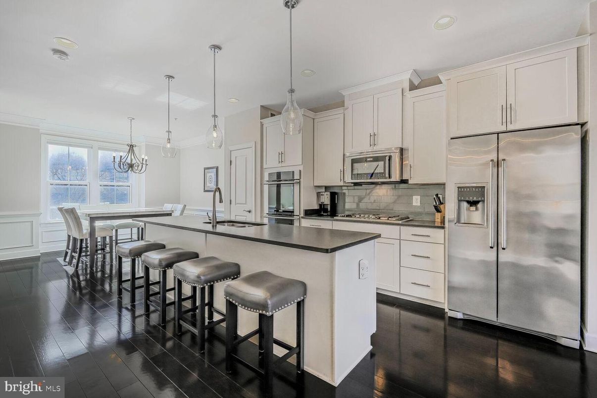 Dining room, Interior, Kitchen, Pendant Lights, Recessed Lighting, Stainless Steel Appliances, Wood Texture Flooring
