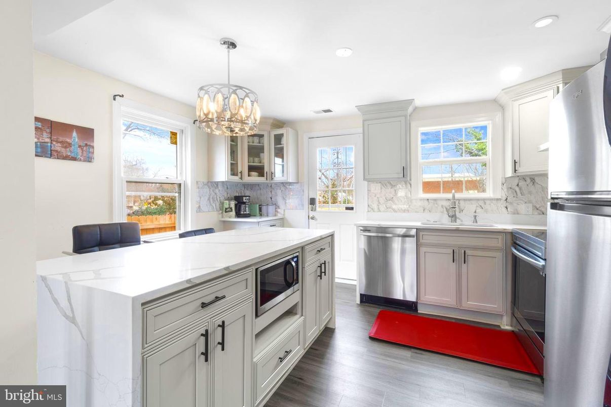 Chandelier, Interior, Kitchen, Marble Walls, Recessed Lighting, Stainless Steel Appliances, Wood Texture Flooring
