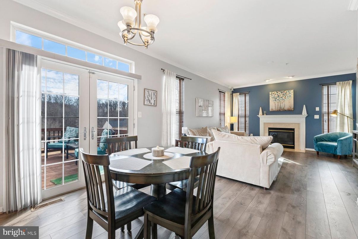 Chandelier, Dining room, Fireplace, Interior, Living room, Recessed Lighting, Wood Texture Flooring