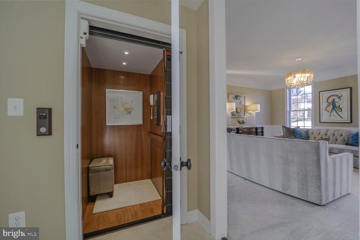 Chandelier, Elevator, Interior, Living room, Recessed Lighting, Wooden Walls