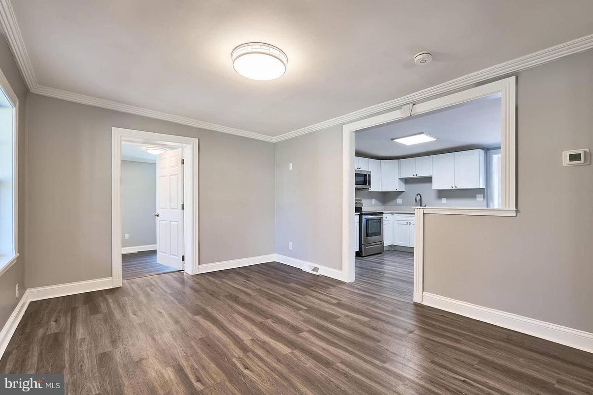 Empty room, Interior, Kitchen, Stainless Steel Appliances, Wood Texture Flooring