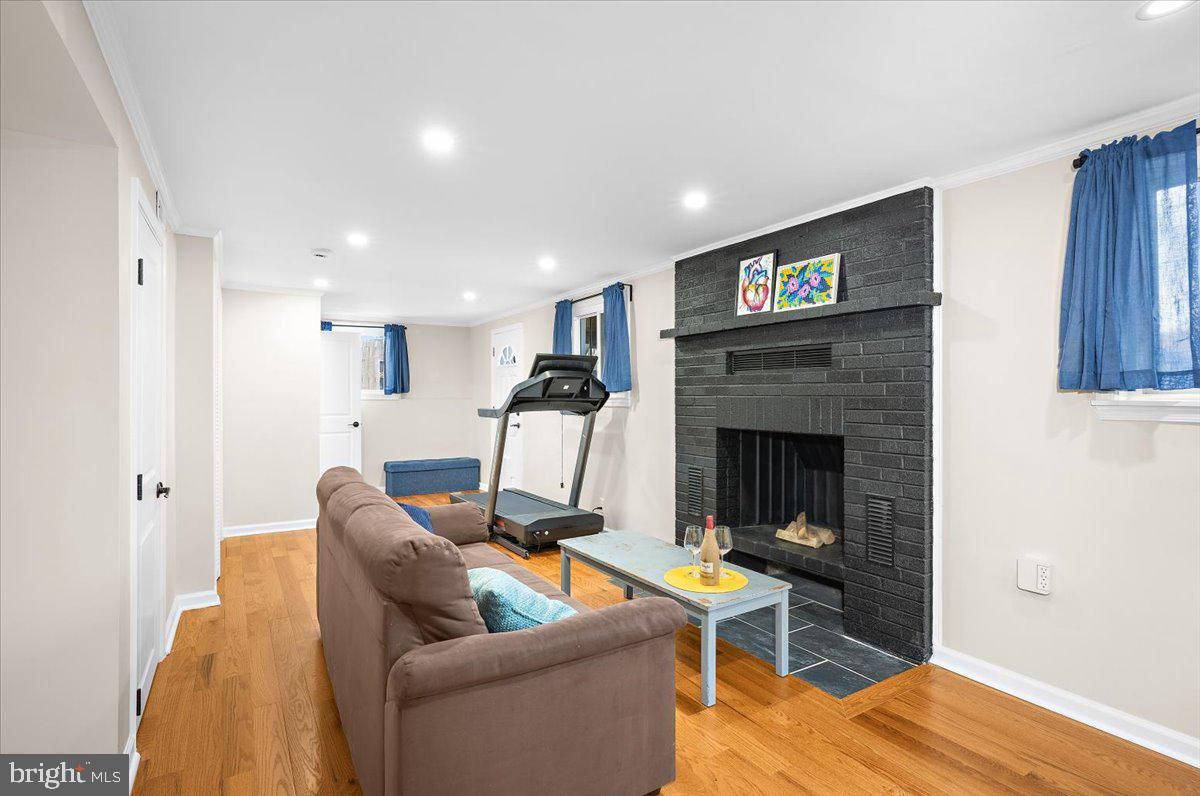 Fireplace, Fitness Equipment, Interior, Living room, Recessed Lighting, Wood Texture Flooring
