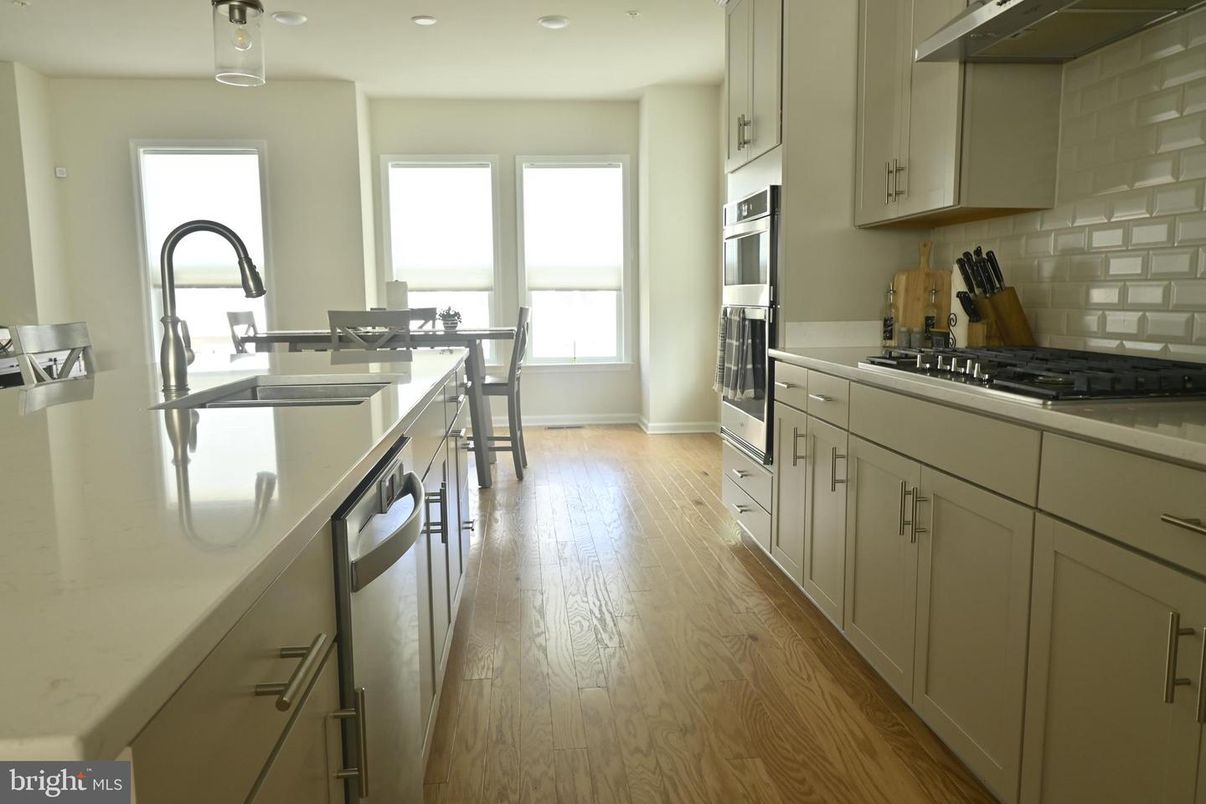 Dining room, Interior, Kitchen, Recessed Lighting, Stainless Steel Appliances, Wood Texture Flooring