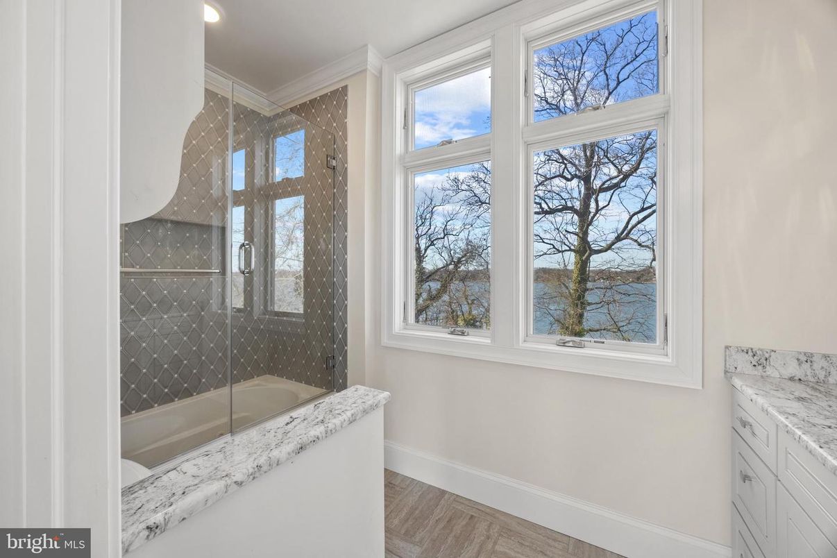 Bathroom, Glass Shower, Interior, Recessed Lighting, Water, Wood Texture Flooring