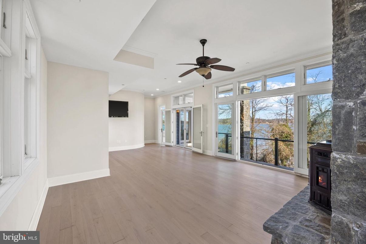 Empty room, Fireplace, Interior, Recessed Lighting, Water, Wood Texture Flooring