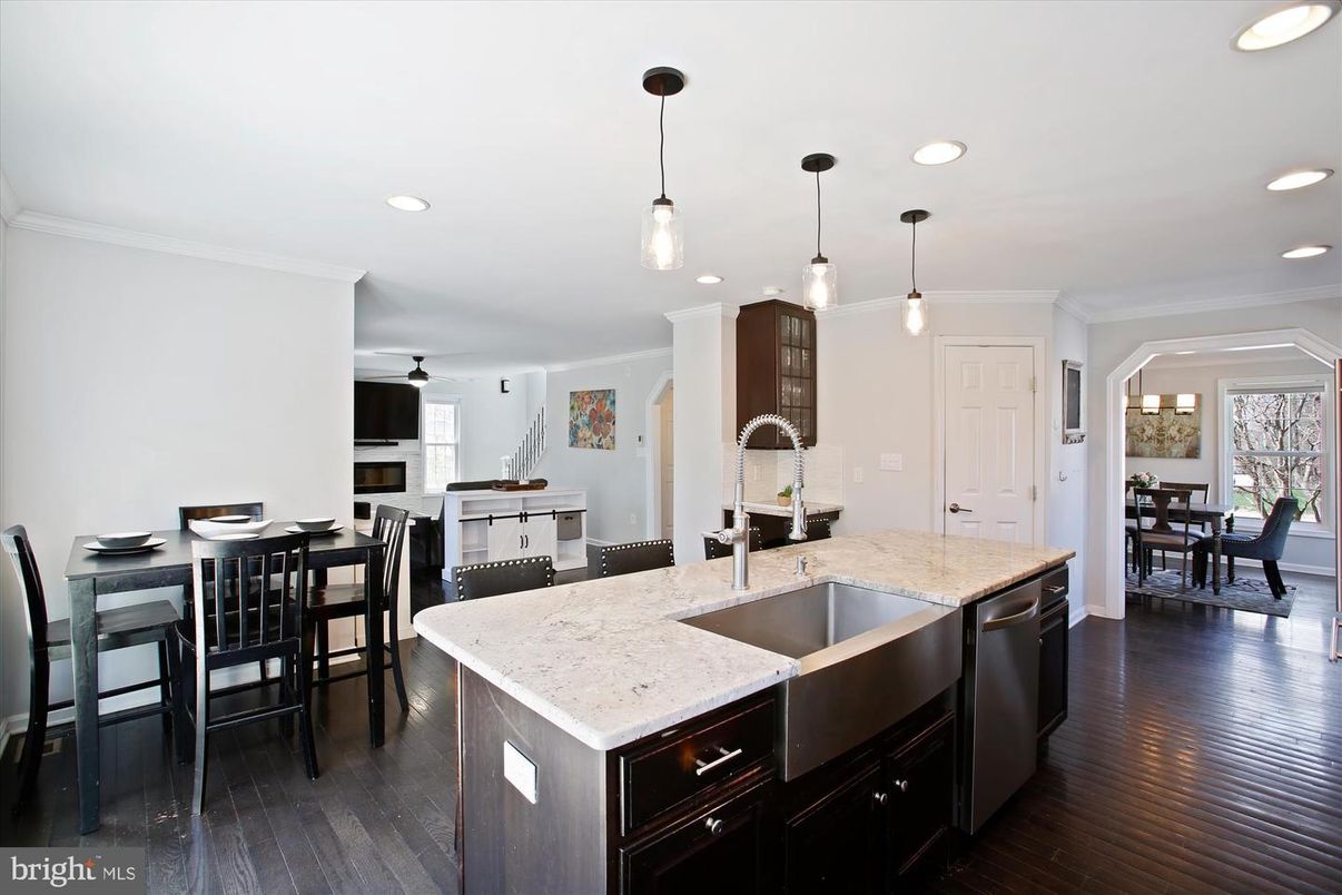 Dining room, Fireplace, Interior, Kitchen, Pendant Lights, Recessed Lighting, Stainless Steel Appliances, Wood Texture Flooring