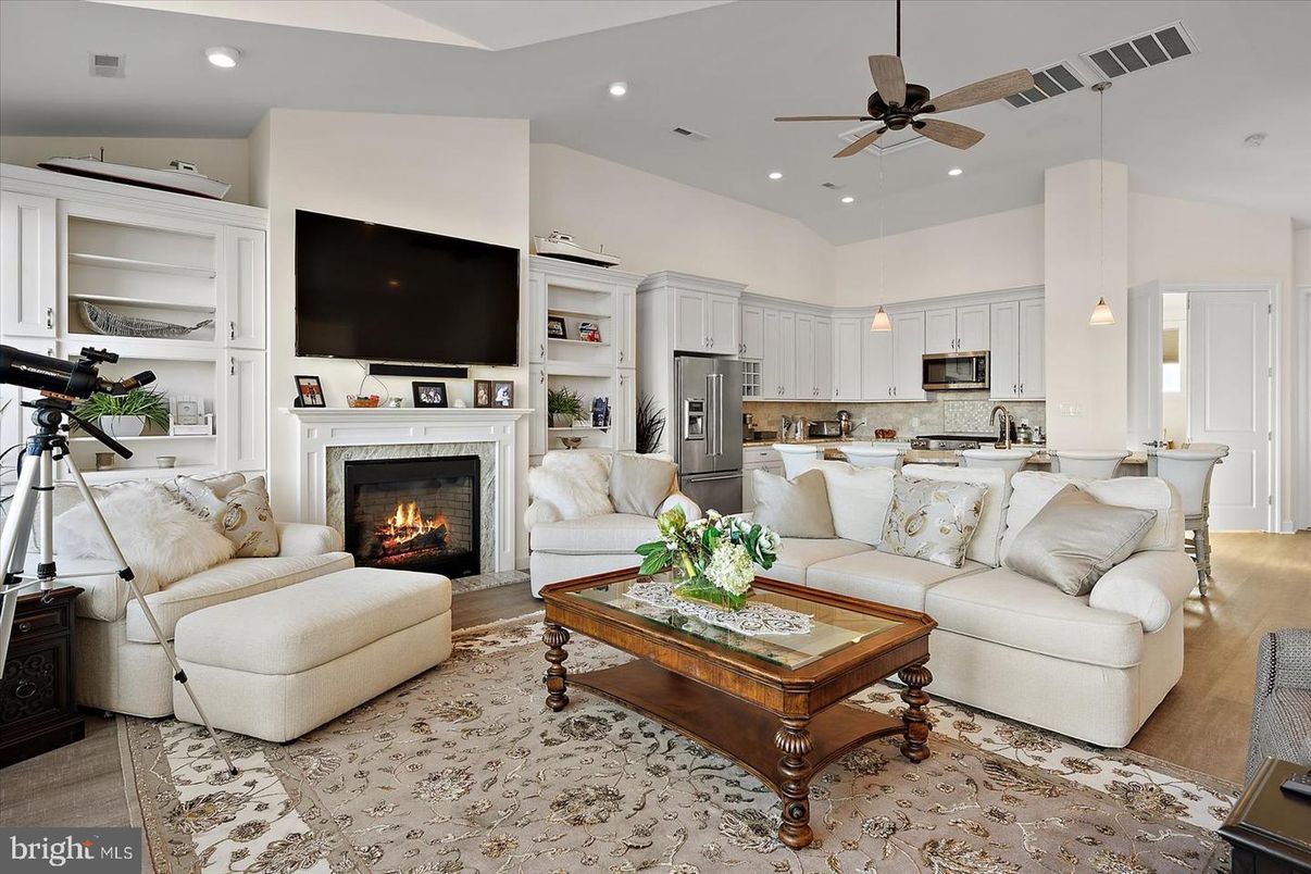 Fireplace, Interior, Kitchen, Living room, Pendant Lights, Recessed Lighting, Stainless Steel Appliances, Wood Texture Flooring