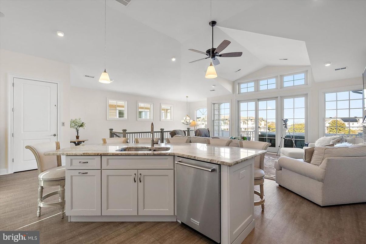 Chandelier, Dining room, Interior, Kitchen, Living room, Pendant Lights, Recessed Lighting, Stainless Steel Appliances, Wood Texture Flooring