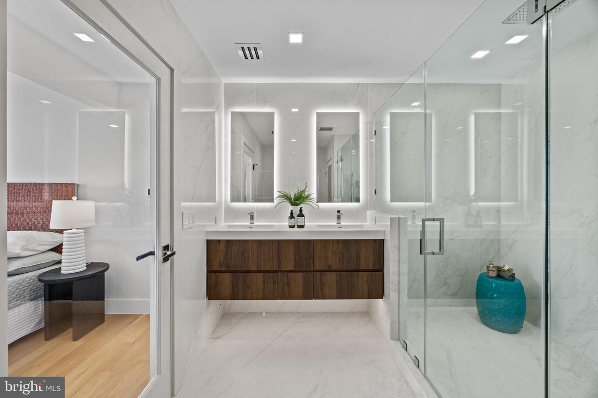 Bathroom, Dual Sink Vanities, Glass Shower, Interior, Marble, Marble Walls, Recessed Lighting, Wood Texture Flooring