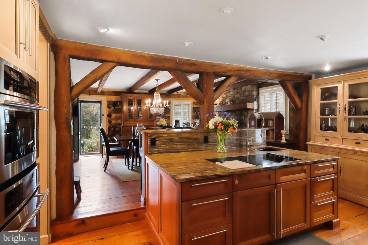 Chandelier, Dining room, Interior, Kitchen, Recessed Lighting, Stainless Steel Appliances, Wooden Beams, Wood Texture Flooring