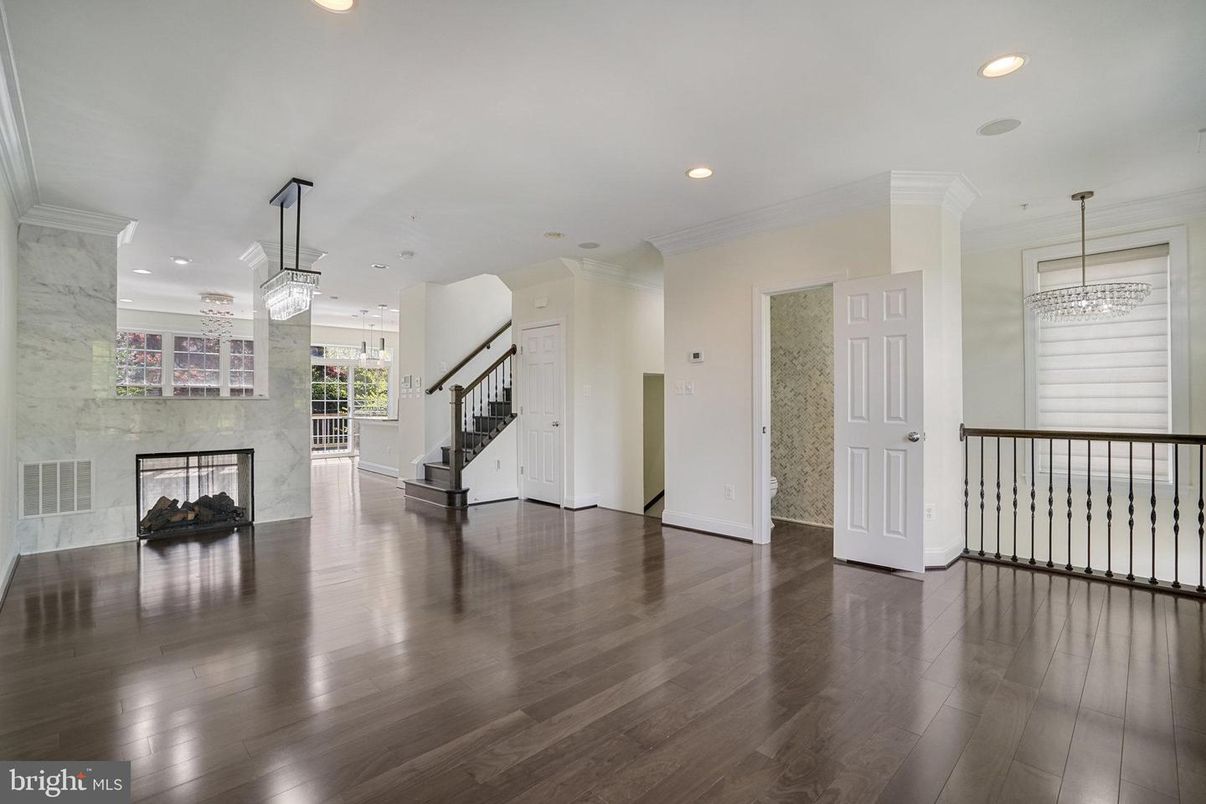 Chandelier, Empty room, Fireplace, Interior, Pendant Lights, Recessed Lighting, Wood Texture Flooring